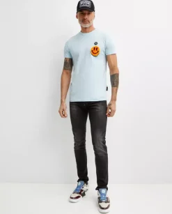 Błękitny t-shirt z naszywką Smile