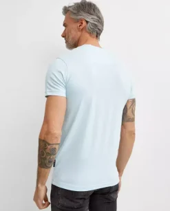Błękitny t-shirt z naszywką Smile