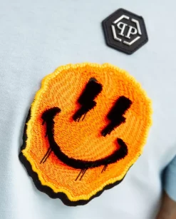 Błękitny t-shirt z naszywką Smile