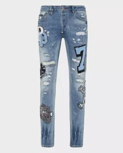 Niebieskie jeansy z naszywkami Super Straight