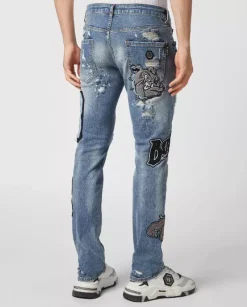 Niebieskie jeansy z naszywkami Super Straight